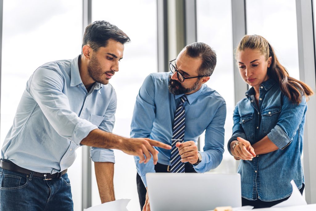 Group Of Professional Business Meeting And Discussing Strategy